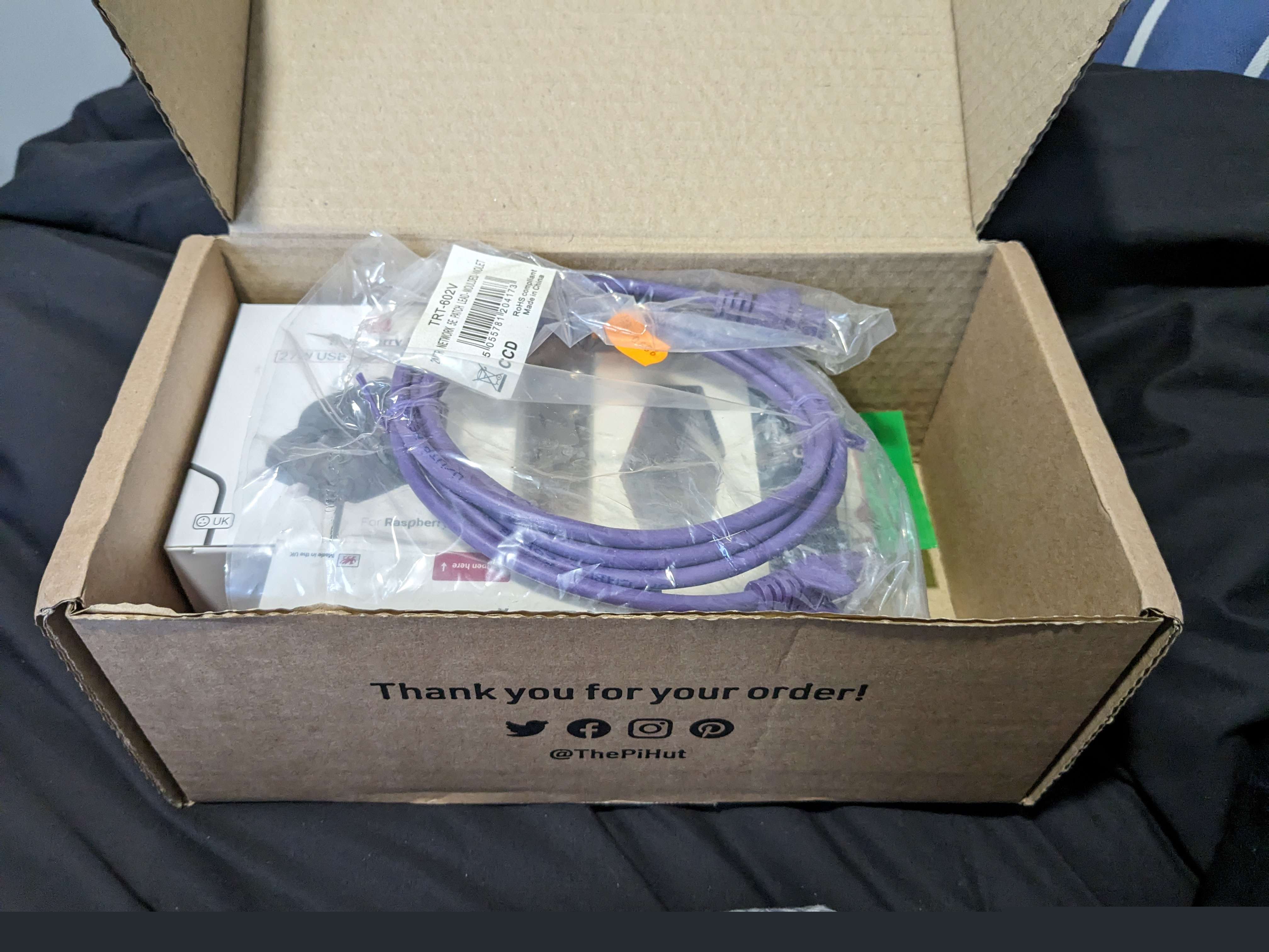 All of the new parts in their postage box